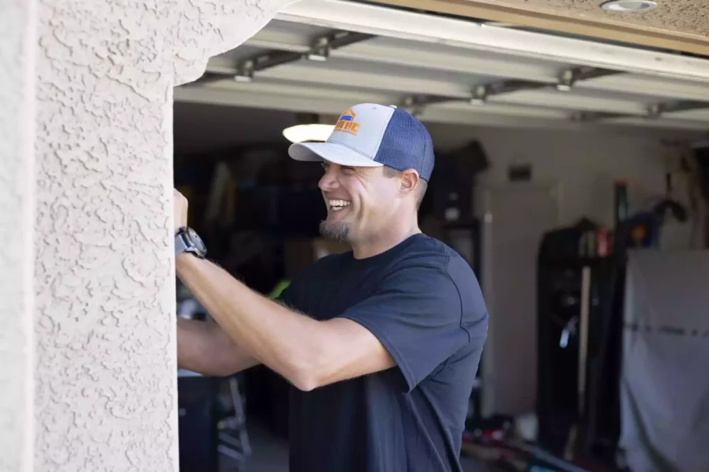 Iconic Garage Door Service repairman servicing garage door keypad