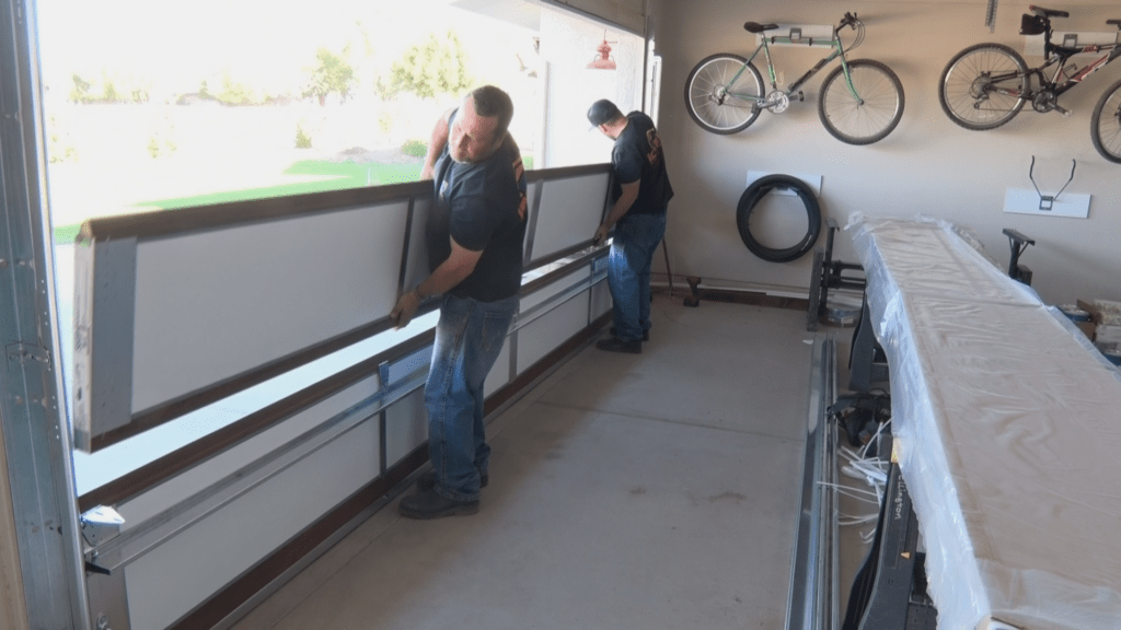 Iconic Garage Door Service installing new garage door