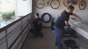 Iconic Garage Door Service garage door installation team installing new garage door
