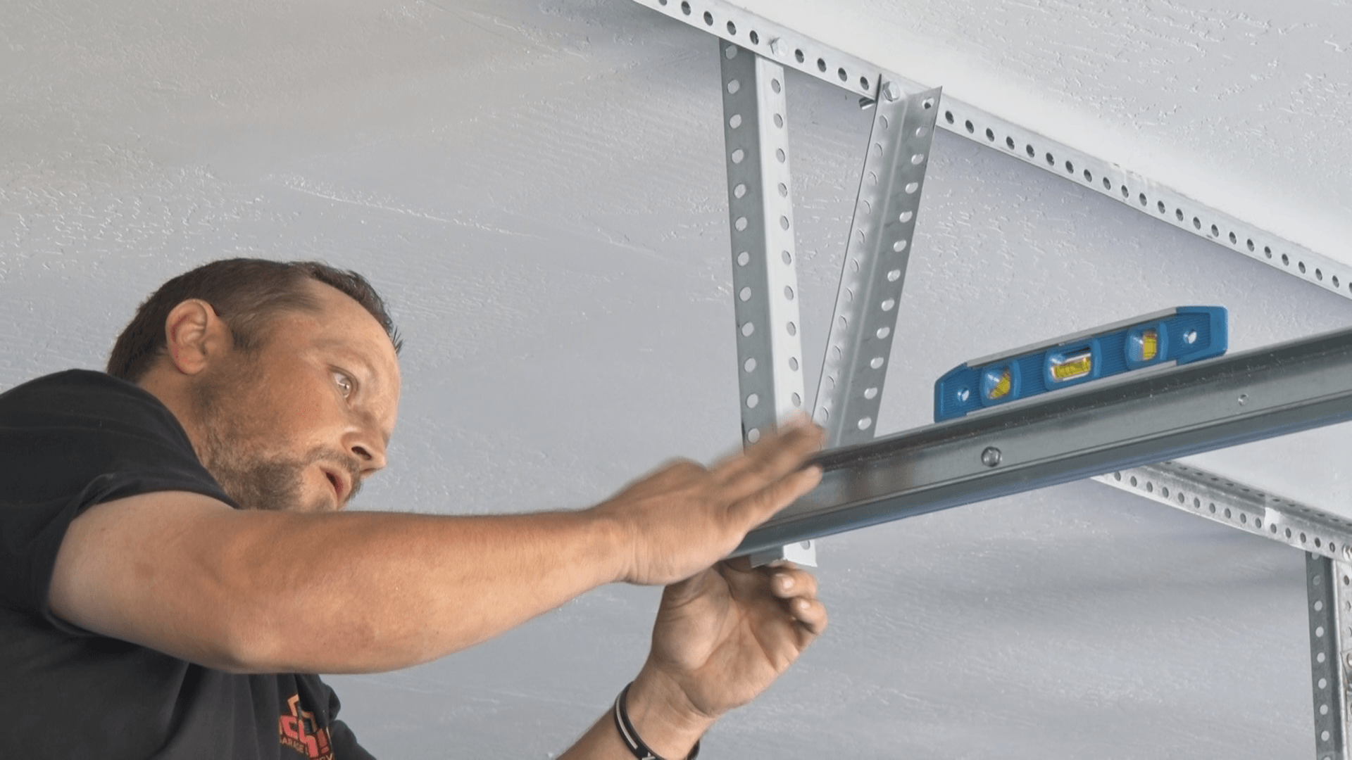 Iconic Garage Door Services repairman working on a garage door repair 