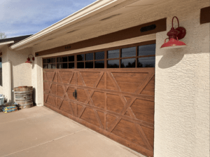 Barn style wood garage doors with an overlay